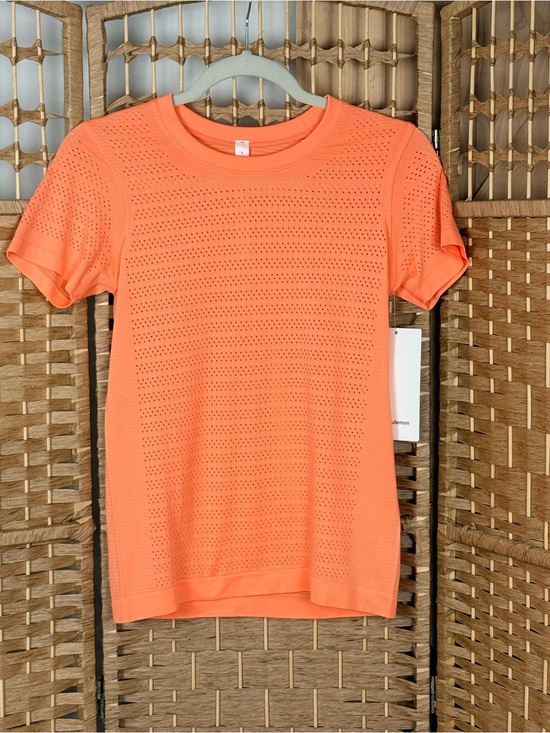 lululemon athletica Tops - NWT Lululemon Breeze By Short Sleeve Size 4 Light Coral Perforated